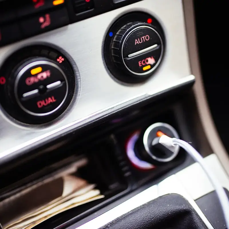 Can I Keep My Car in Chapter 7? Three Options, Explained — Car interior close-up with dashboard controls and charging cable
