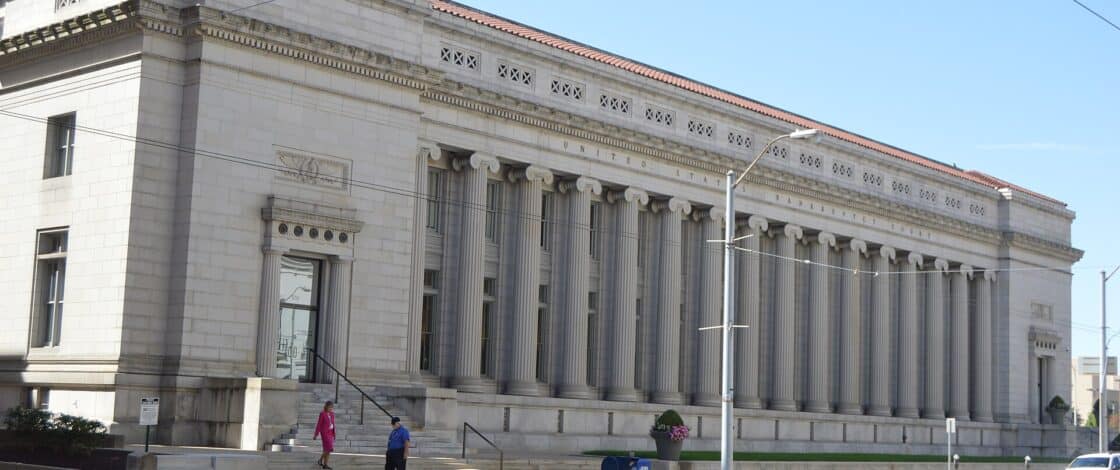 Exterior of a United States Bankruptcy Court building, with the words carved into the stone frieze.