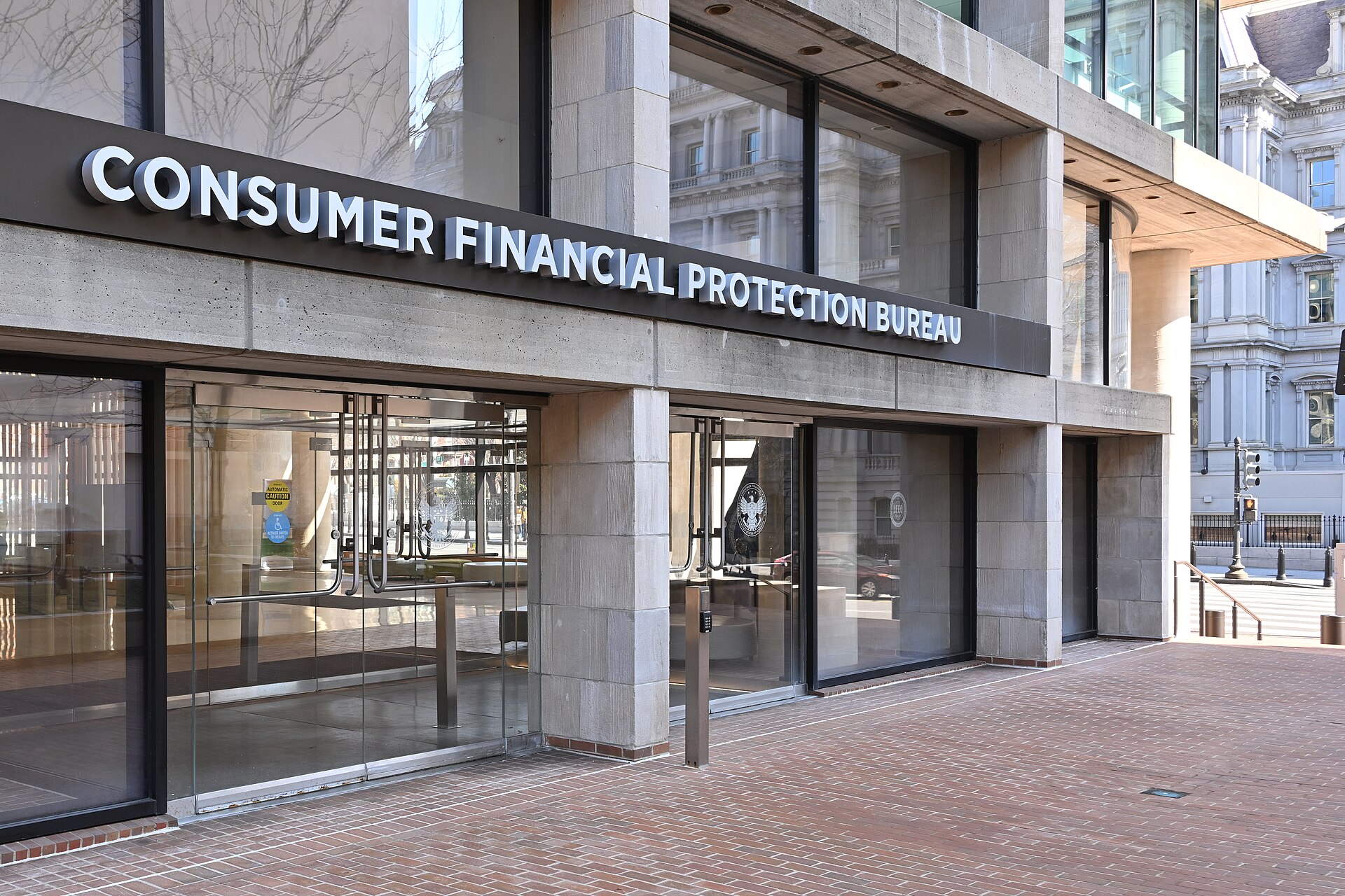 The entrance to the Consumer Financial Protection Bureau headquarters in Washington DC, with the bureau name above the door