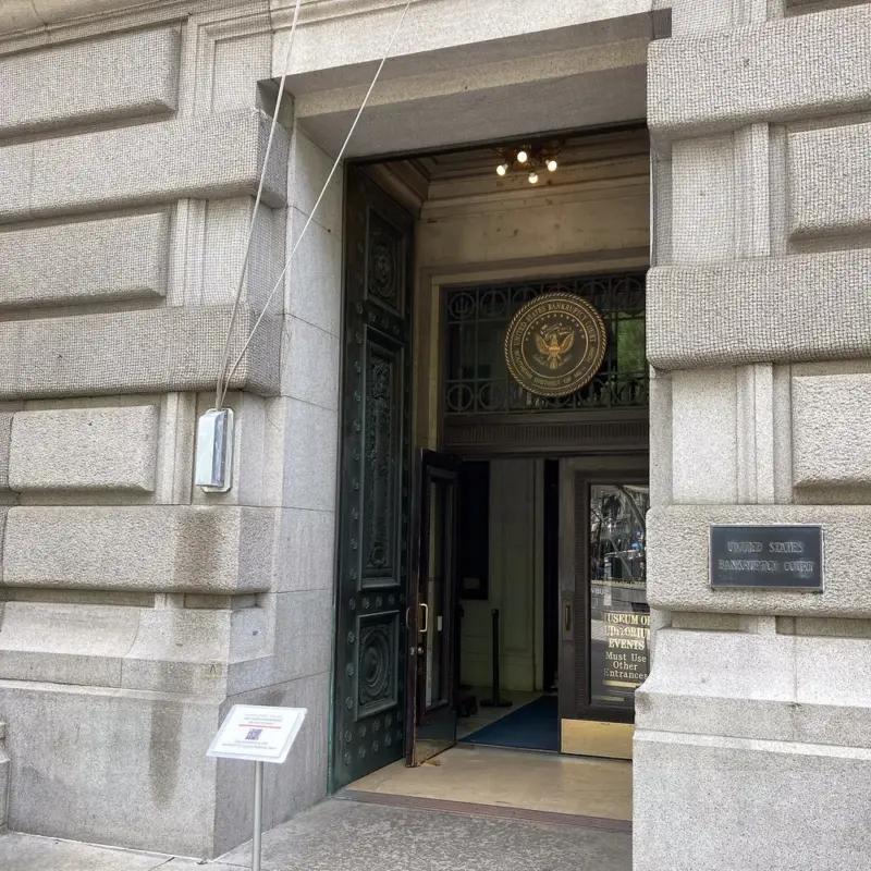 Entrance to a United States Bankruptcy Court, with the federal seal above the door
